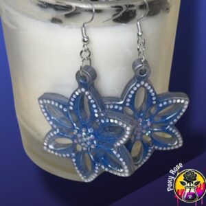 Handmade blue flower resin earrings with white sparkle accents on dangle hooks, lightweight and perfect for weddings or spring outfits