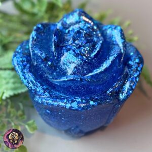 Blue resin rose trinket jar with glitter finish, ideal for jewelry or keepsakes