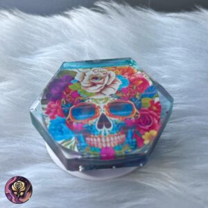 Hexagon resin pop socket featuring a floral sugar skull with pink and blue flowers, handmade and colorful.