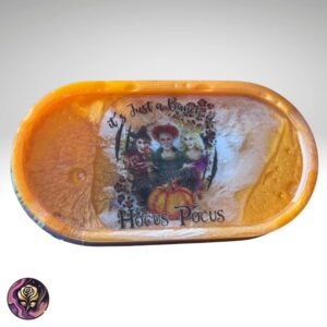 Handmade oval Halloween resin trinket tray with embedded glitter and spooky charm, perfect for organizing jewelry or gifting as decorative holiday storage
