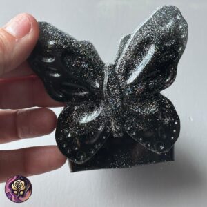 Handmade Black Glitter Butterfly Candle Holder with shimmering resin wings, designed for votive or tealight use, perfect for gothic or glam decor