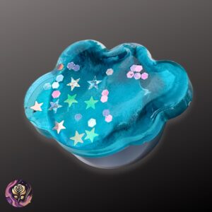 Handmade blue resin pop socket with glitter stars, shown on a white background — round phone grip with cosmic sparkle and custom design.