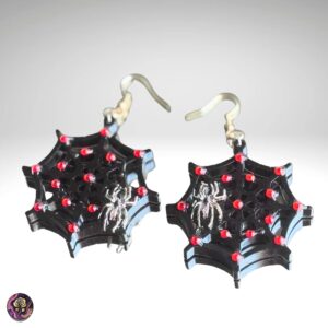 Handmade resin spider web earrings with red glitter accents and silver spider charm, Halloween statement jewelry by Poxy Rose