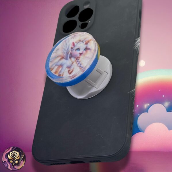 Blue unicorn resin phone grip with glitter and pastel fantasy details – adhesive pop socket stand for phones, Kindles, and tablets.