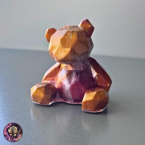 Burgundy and gold resin bear figurine with shimmering accents, handmade as a decorative gift or collectible shelf piece