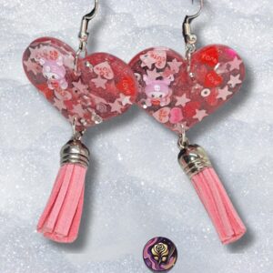 Handmade pink resin heart earrings with glitter and tassel dangles, lightweight Valentine jewelry for women.