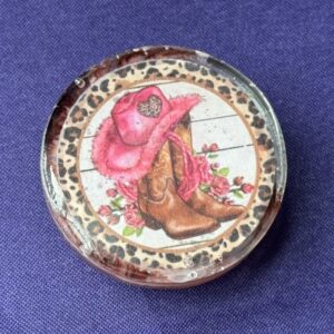 Top-down image of cowgirl resin phone grip, handmade with floral and western design